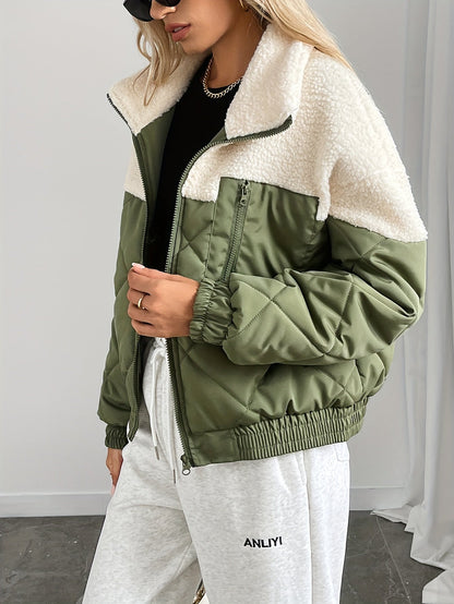 Person wearing a green and white jacket with a plain background