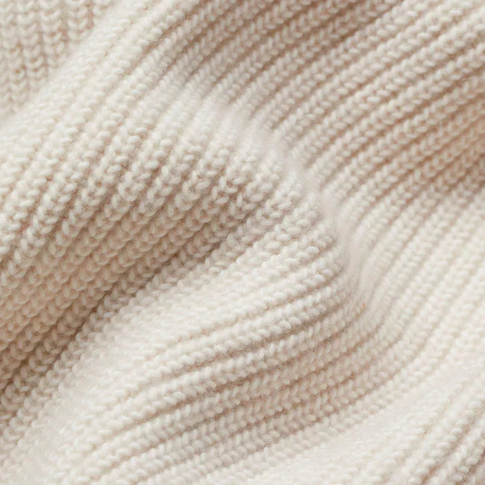 Close-up of beige yarn with a textured pattern