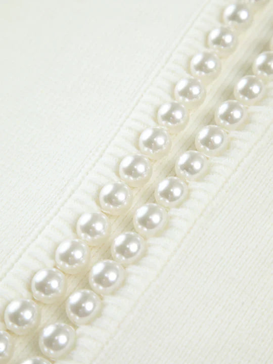 Close-up of a row of pearls on a white background