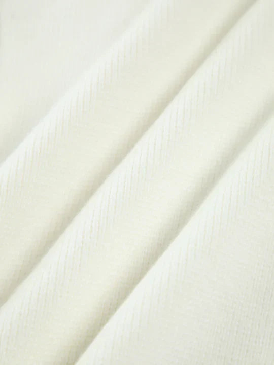 Close-up of white fabric with a subtle pattern