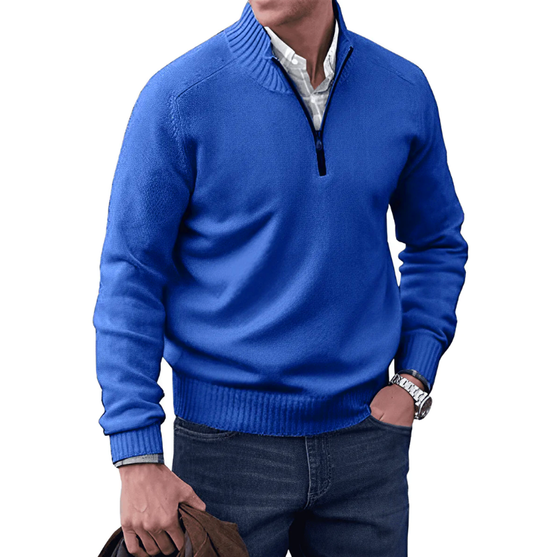 Blue sweater worn by a person on a white background