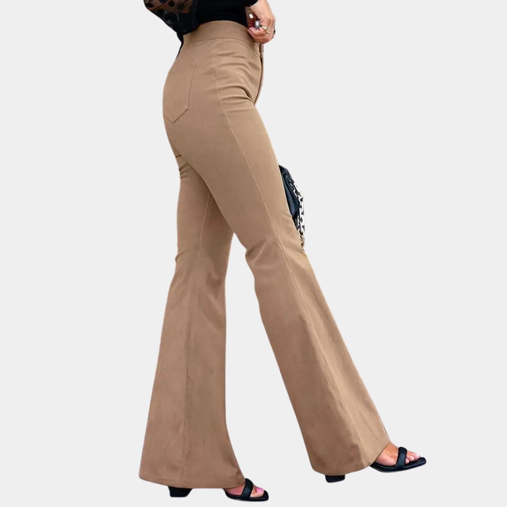 Beige flared pants worn by a person on a white background