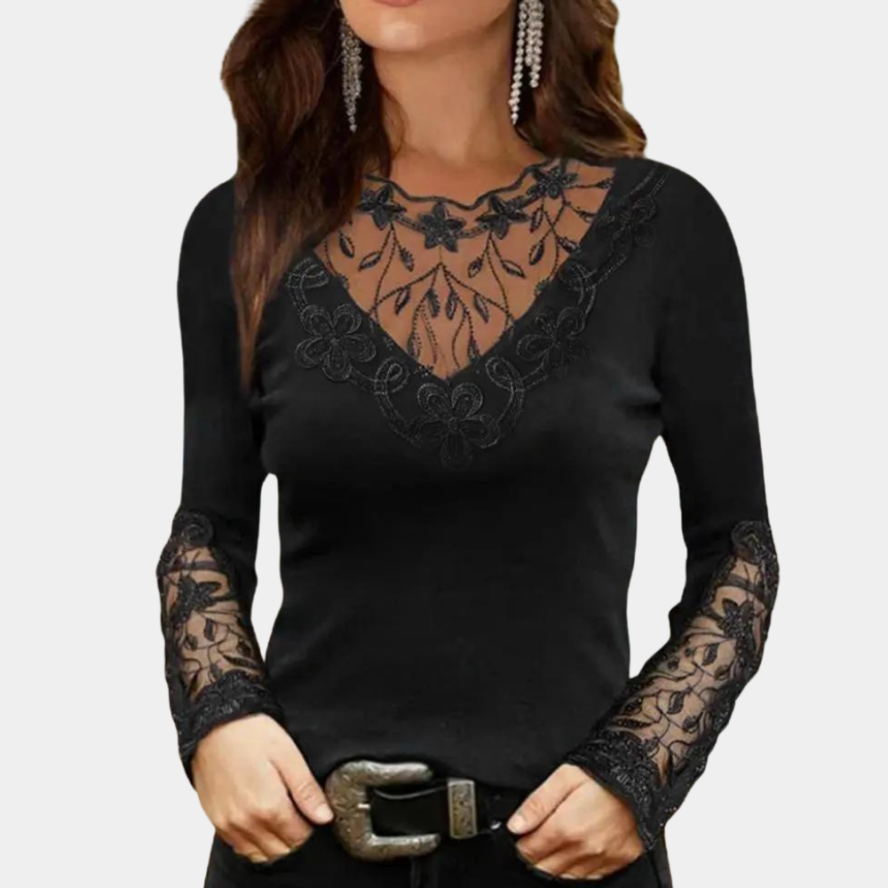 Black long-sleeve top with lace detailing on a plain background
