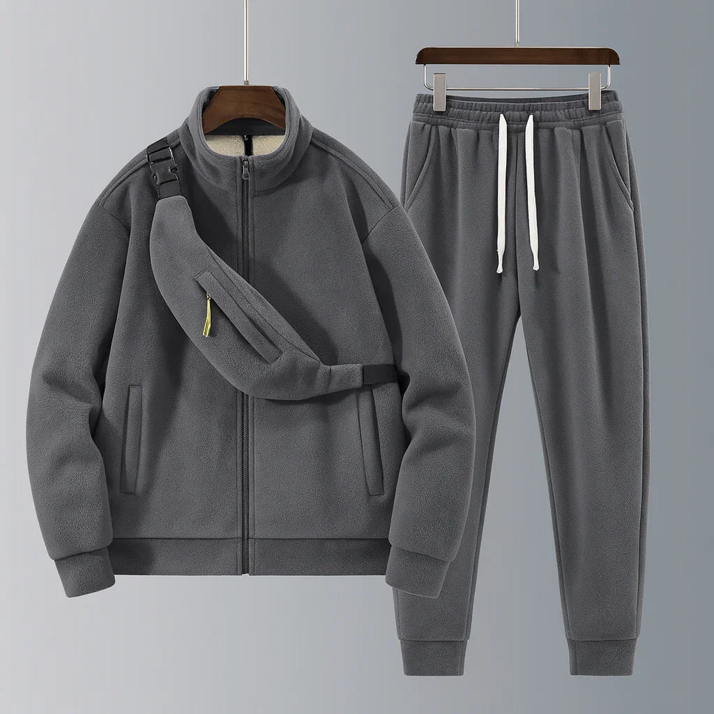 Gray tracksuit with jacket and pants on a gray background