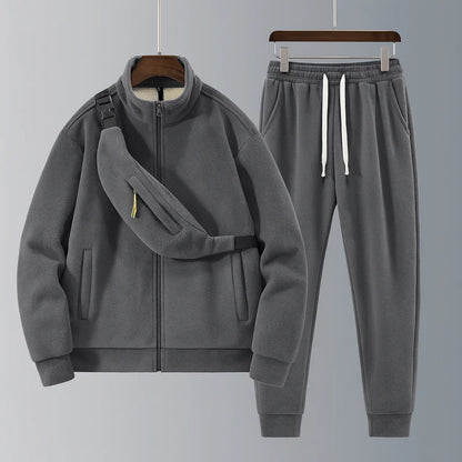 Gray tracksuit with jacket and pants on a gray background