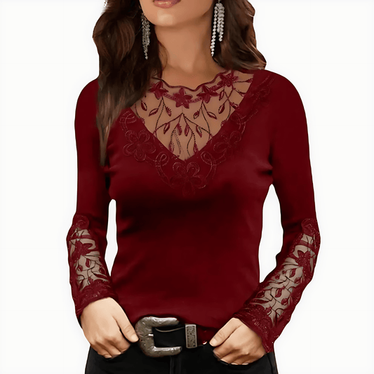 Red long-sleeve top with lace details on a white background