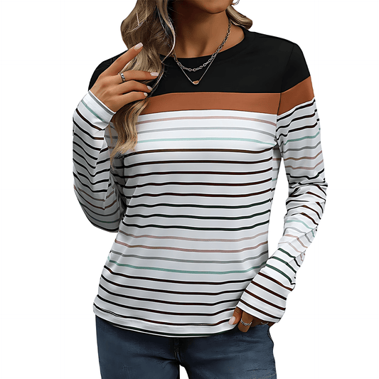 Woman wearing a black and white striped long-sleeve top with brown accents on a white background