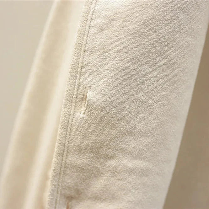 Close-up of beige fleece fabric with a zipper
