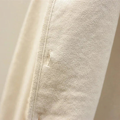 Close-up of beige fleece fabric with a zipper