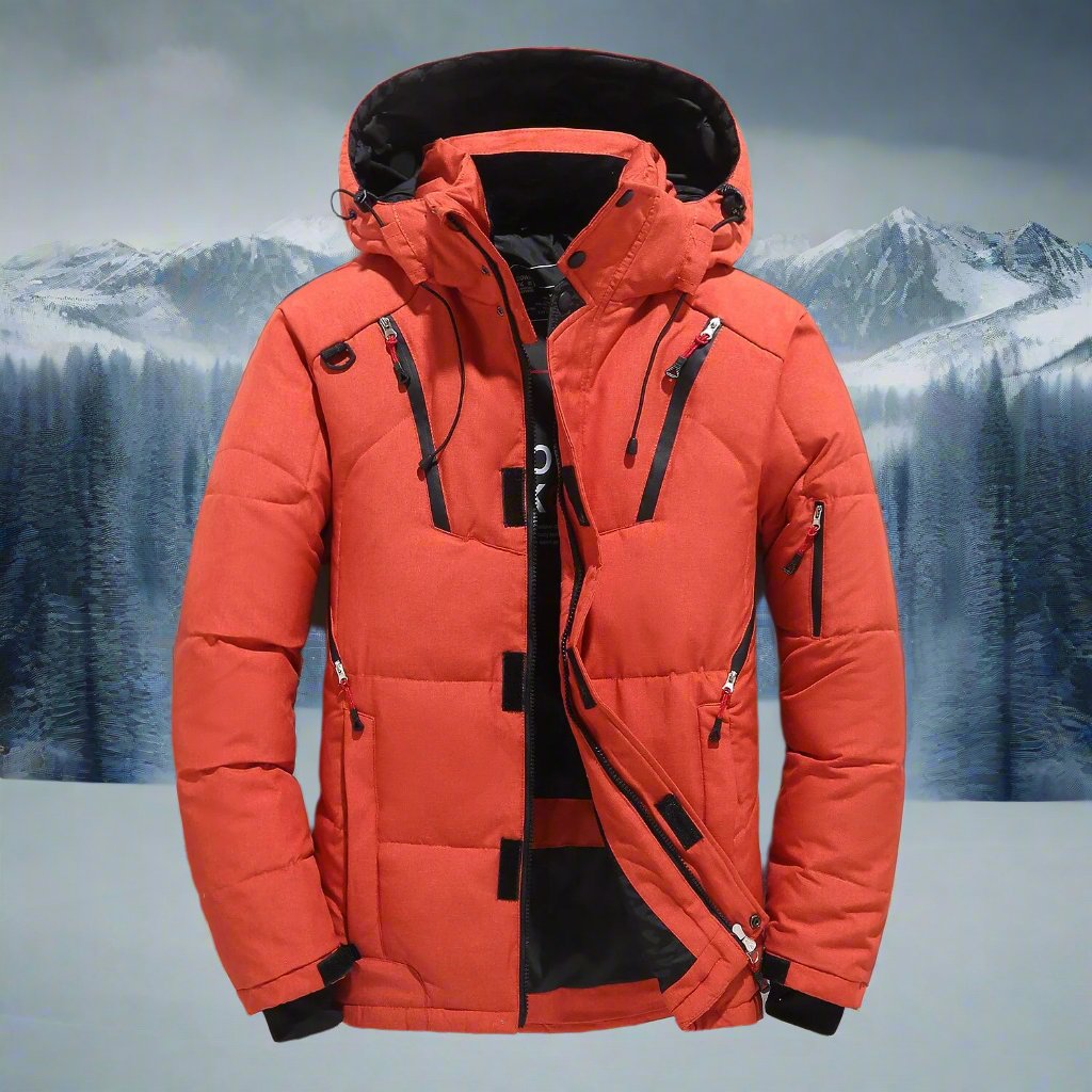 Orange winter jacket with black accents against a snowy mountain background