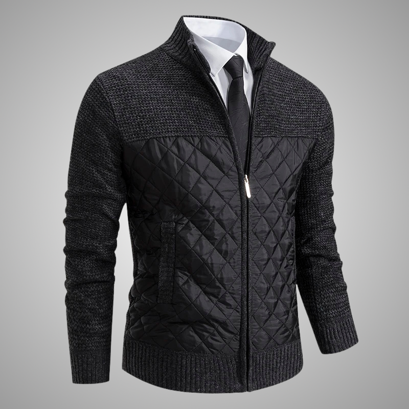 Black quilted jacket with a white shirt and tie on a gray background