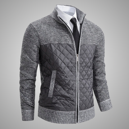 Gray quilted jacket with a textured pattern on a gray background