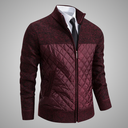 Maroon quilted jacket with a white shirt and black tie on a gray background