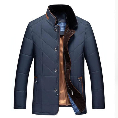 Blue quilted jacket with brown lining on a white background