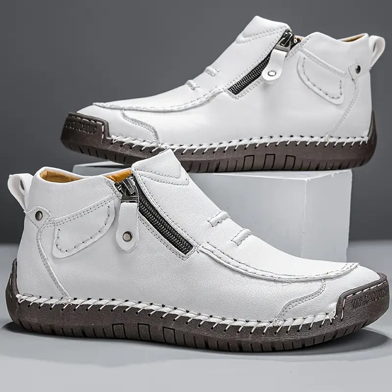 White high-top sneakers with zippers on a gray background