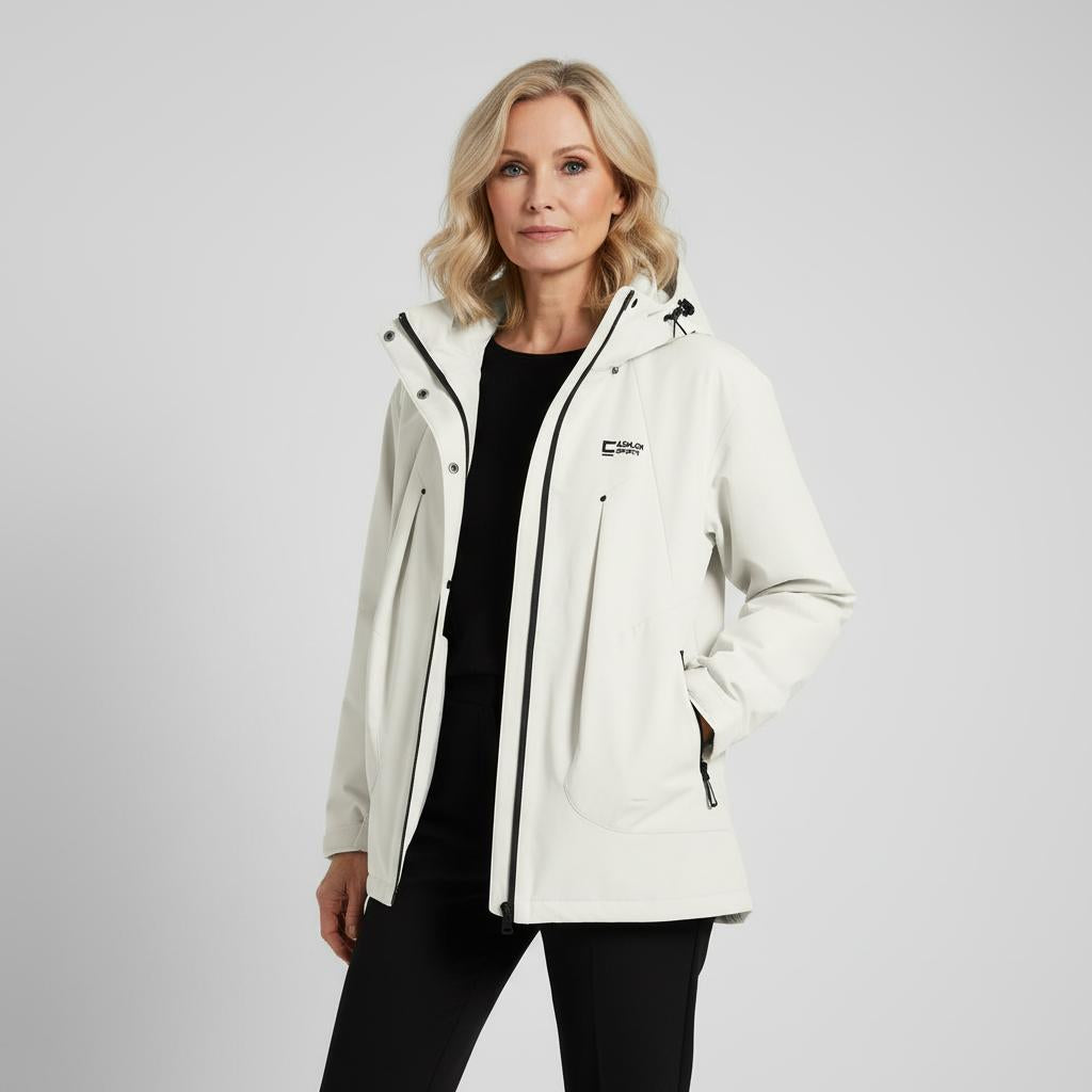 Woman wearing a white jacket with a brand logo on a gray background