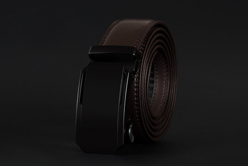 Brown leather belt with black buckle on a dark background