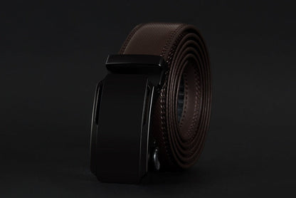 Brown leather belt with black buckle on a dark background