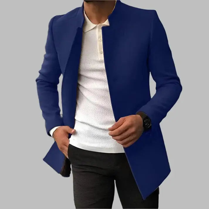 Blue blazer over a white shirt and black pants on a gray background
