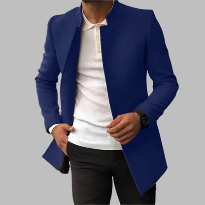 Blue blazer over a white shirt and black pants on a gray background