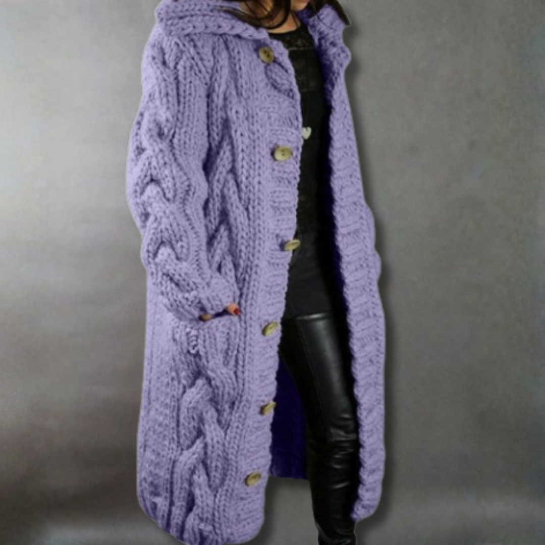 Long purple knitted coat with button details on a plain background