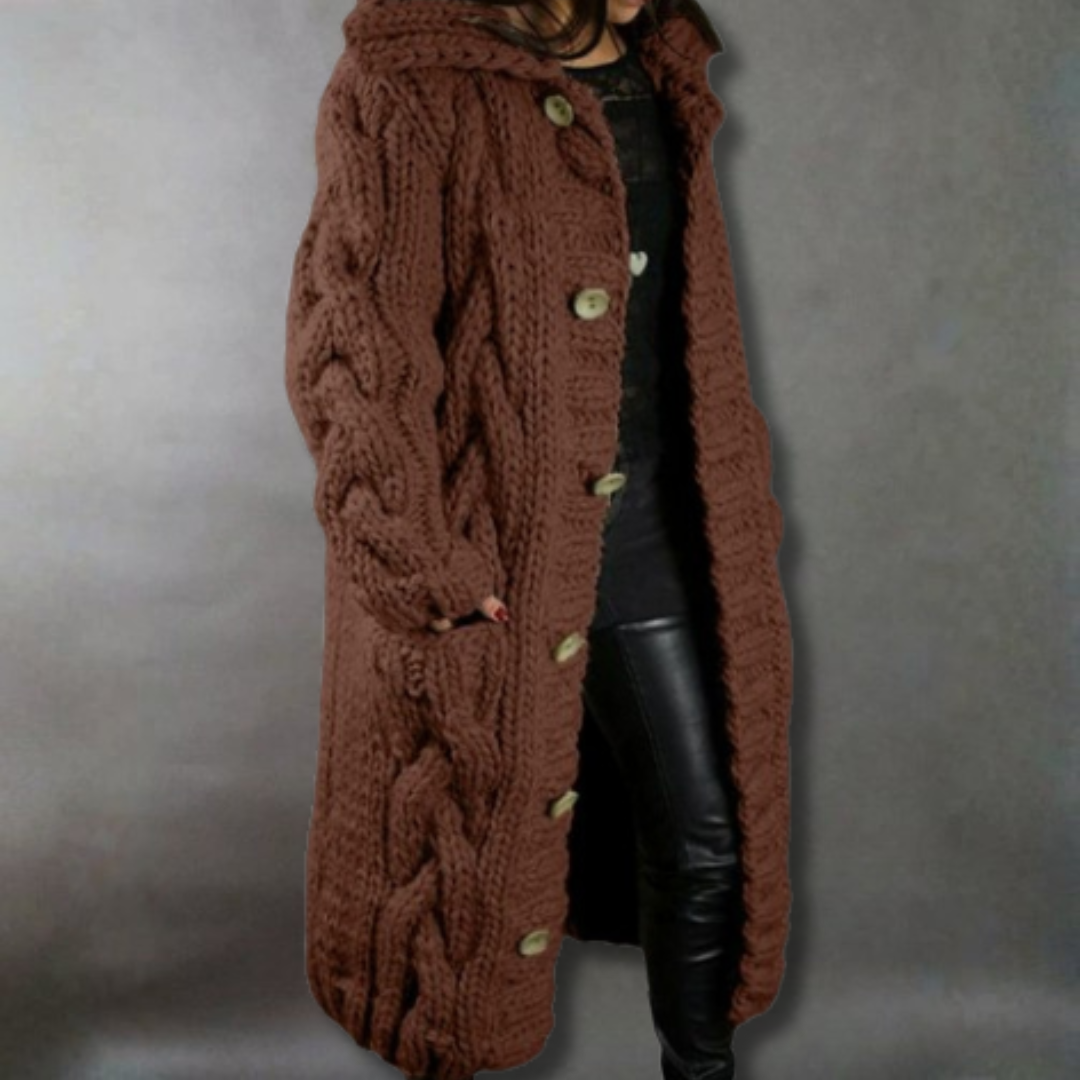Brown cable knit coat with buttons on a gray background
