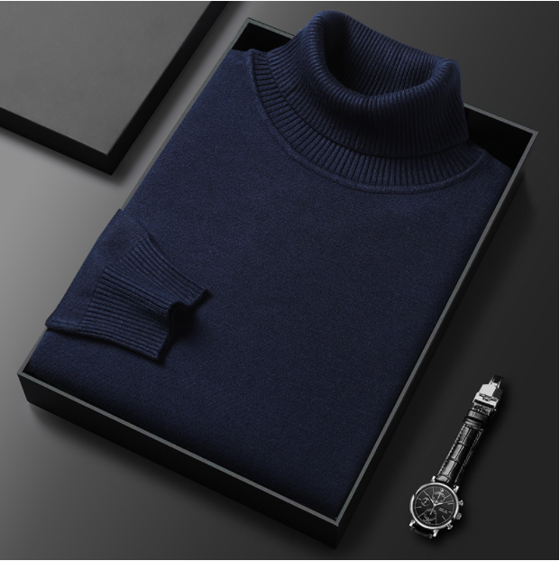 Folded navy blue turtleneck sweater displayed with a watch.