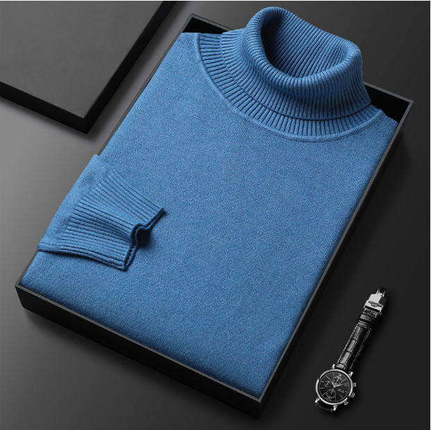 Folded blue turtleneck sweater displayed with a watch.
