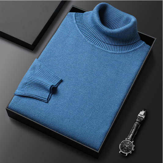 Folded blue turtleneck sweater displayed with a watch.