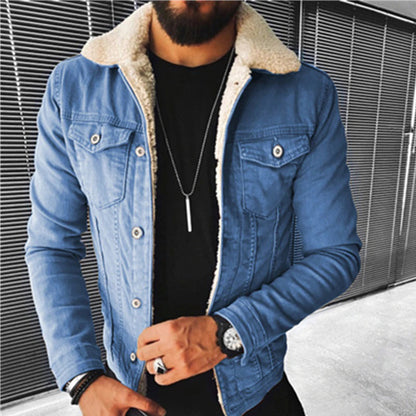 Man wearing a blue denim jacket with sherpa lining against a metallic background