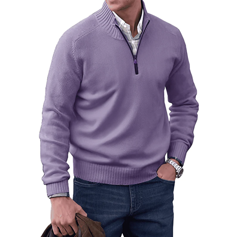 Man wearing a purple sweater with a white shirt underneath on a white background