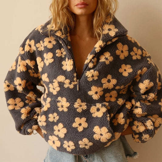 Floral patterned jacket worn by a person on a beige background