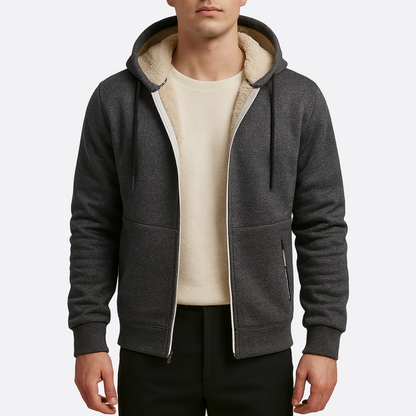 Person wearing a gray hoodie with a cream interior lining on a white background