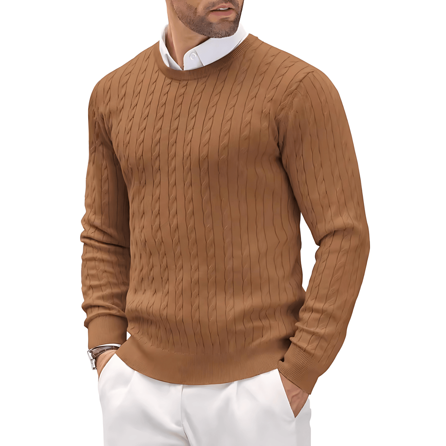 Man wearing a brown cable knit sweater over a white shirt with white pants on a white background