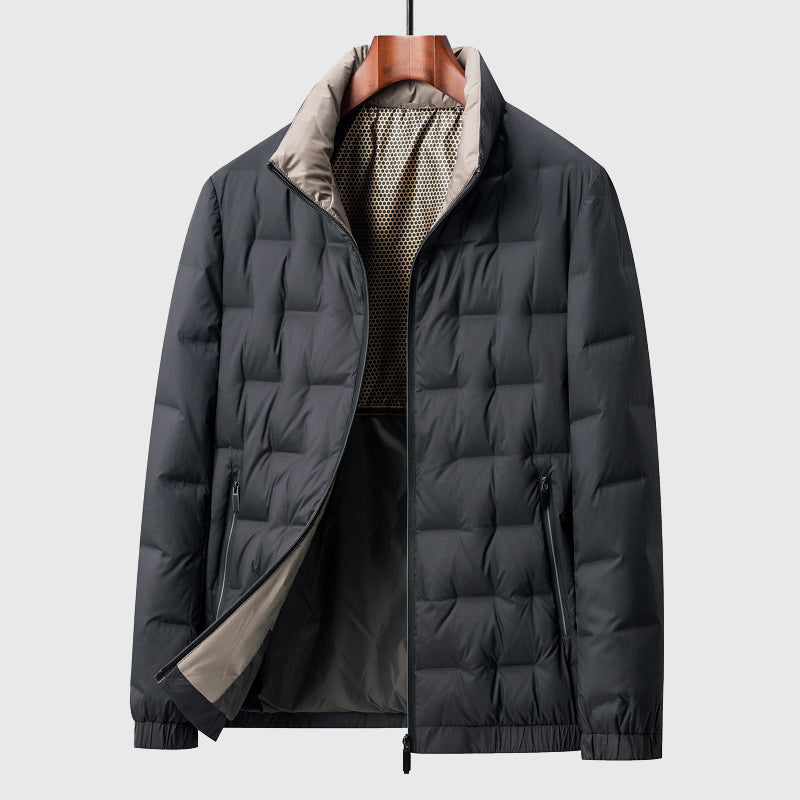 Black puffer jacket on a hanger against a light gray background