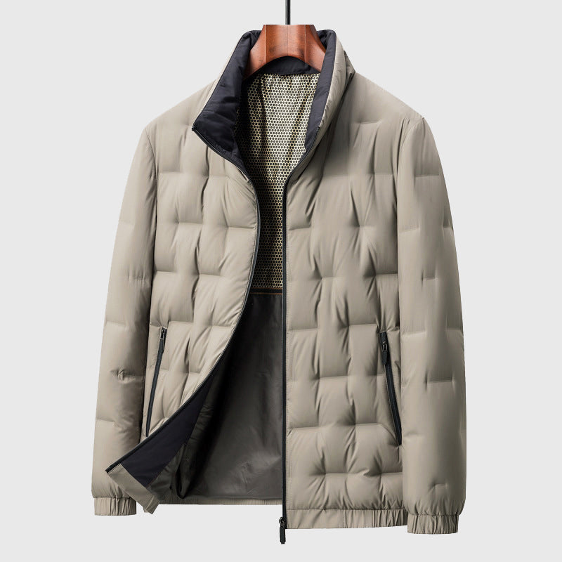 Beige puffer jacket on a hanger against a light gray background