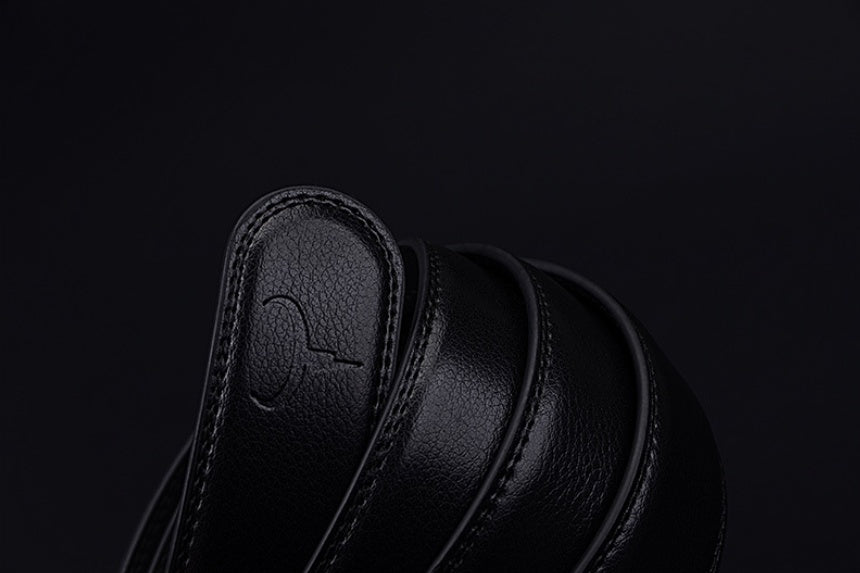 Black leather shoe on a black background