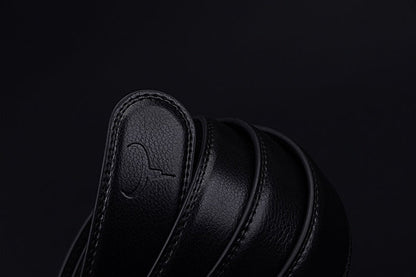 Black leather shoe on a black background