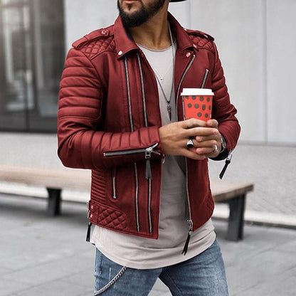 Man wearing a red jacket holding a red coffee cup with a polka dot pattern.