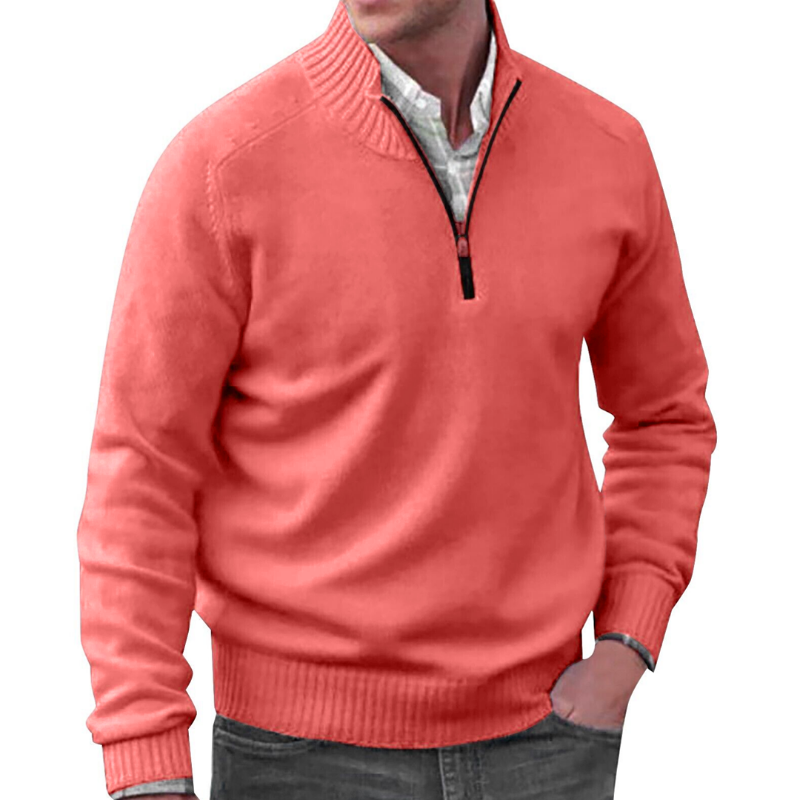 Man wearing a coral pink sweater with a white shirt underneath on a white background