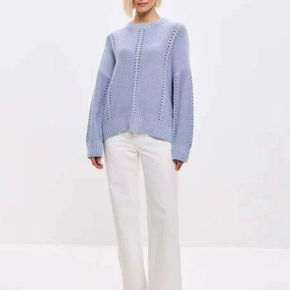 Light blue sweater worn by a person on a white background