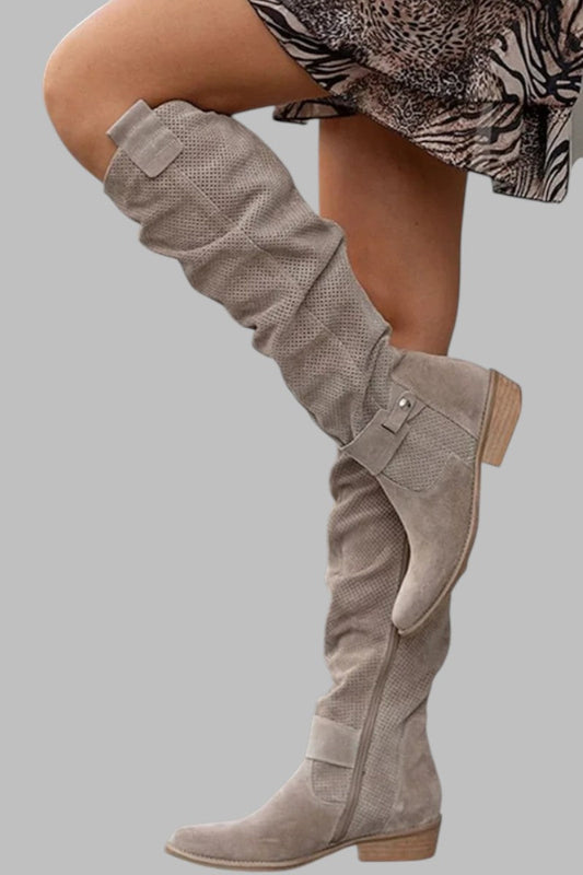 Beige knee-high boot on a gray background