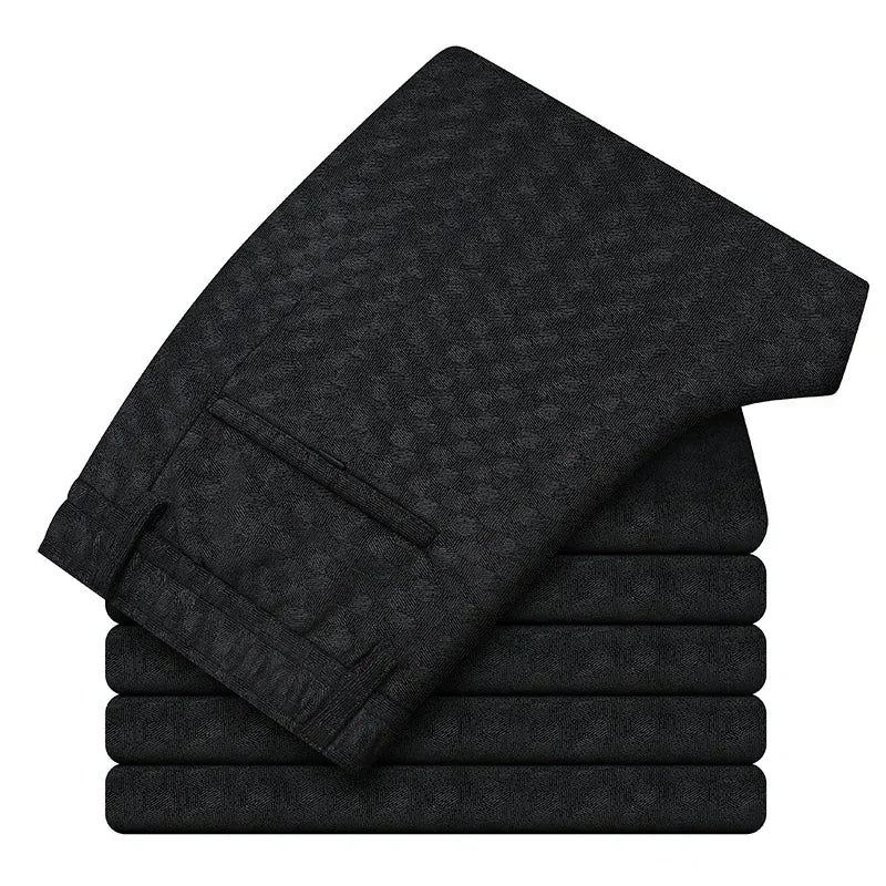 Stack of black towels on a white background