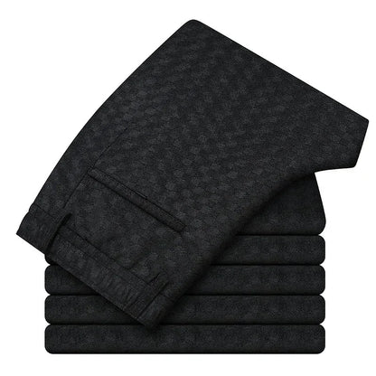 Stack of black towels on a white background
