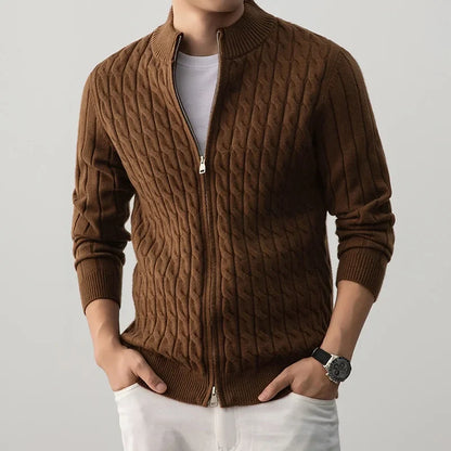 Brown cable knit sweater with a person wearing it on a light gray background