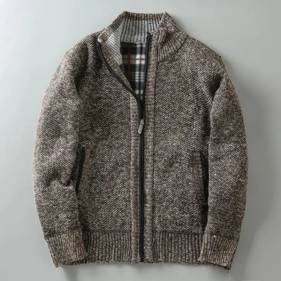 Brown knitted jacket with a zipper on a light gray background