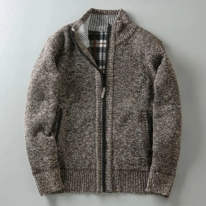 Brown knitted jacket with a zipper on a light gray background