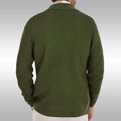 Green sweater worn by a person on a light gray background