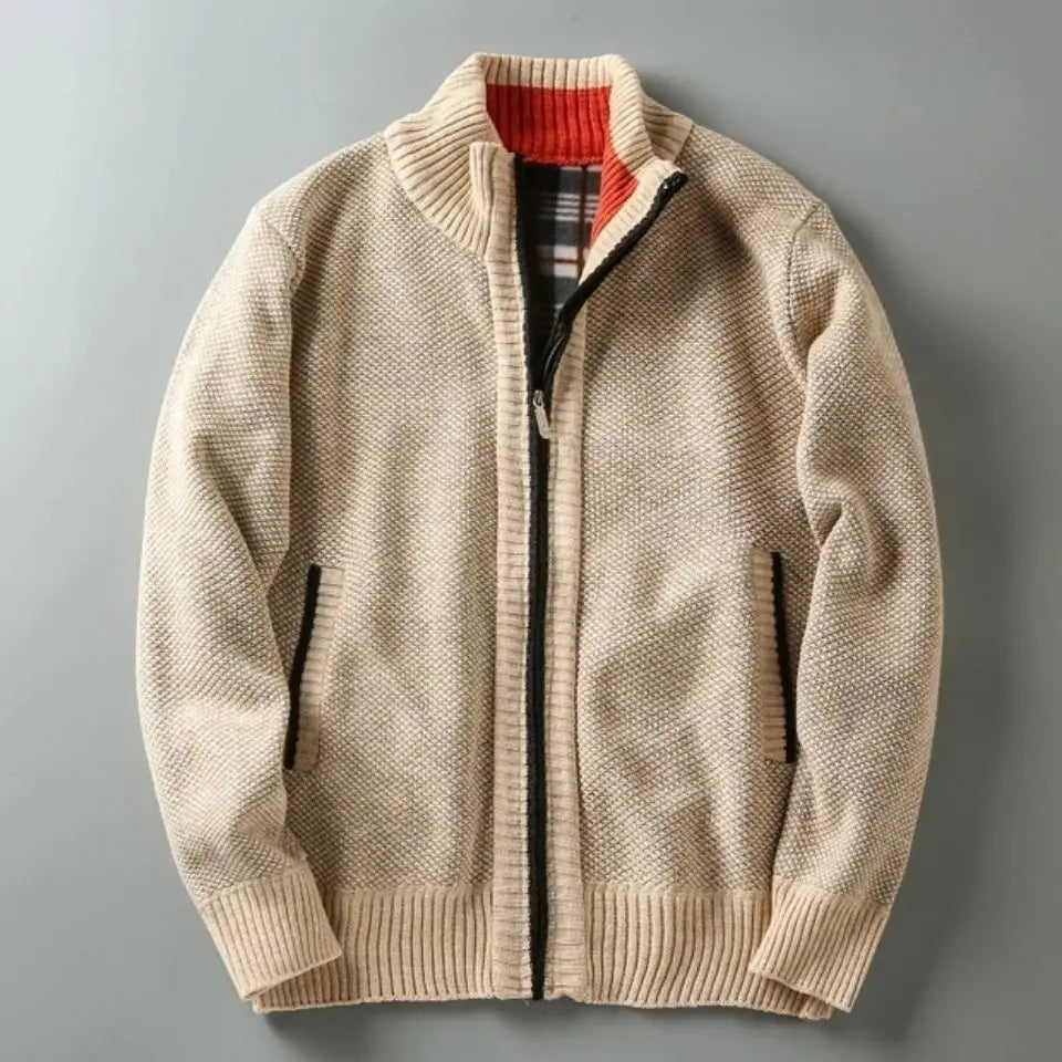 Beige knitted jacket with a plaid lining on a gray background