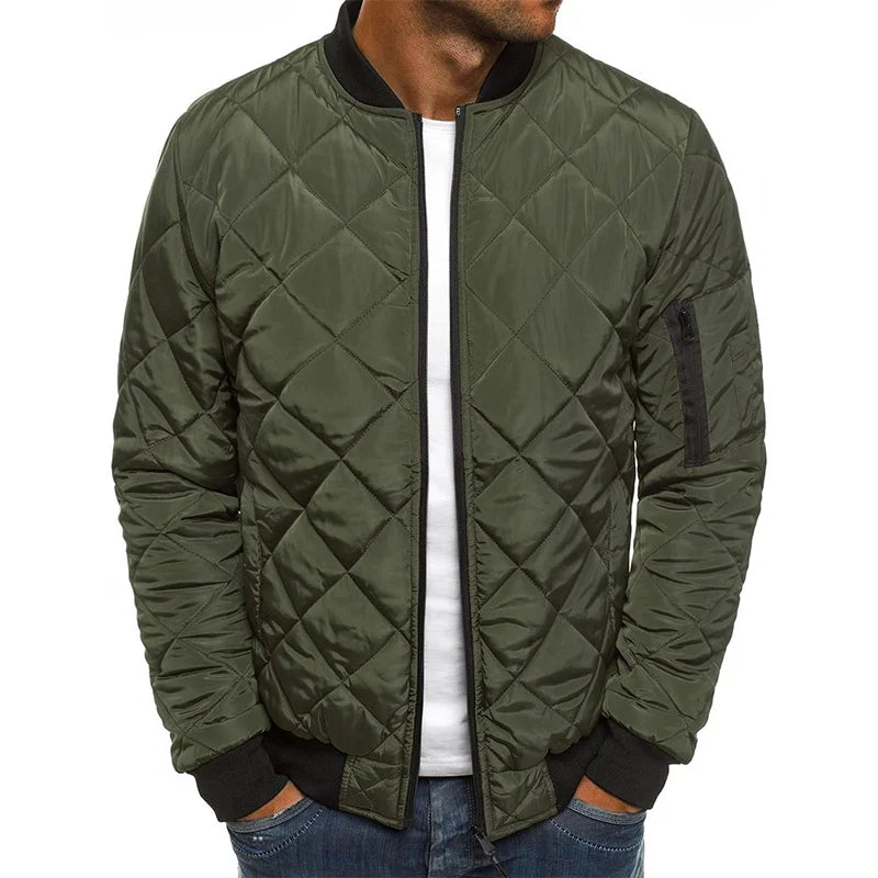 Green quilted jacket worn by a person on a white background